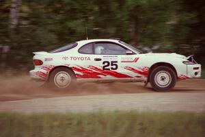 Jeff Panton / Rudy Meikle accelerate their ex-Carlos Sainz Toyota Celica GT-4 away from the spectator area at the county road.