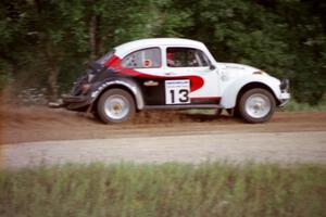 Rene Villemure / Mike Villemure accelerate their VW Beetle away from the spectator point on Indian Creek Trail Rd.