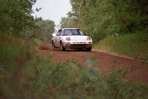 Brian Pepp / Dean Rushford at speed down Indian Creek Trail Rd. in their Mazda RX-7.