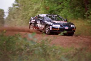 Jim Anderson / Ben Greisler come over a crest on Indian Creek Trail Rd. in their Honda Prelude VTEC.