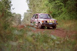 The Lynn Anderson / Barry Berg VW GTI comes over a crest on Indian Creek Trail Rd.