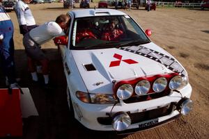 Dave Fuss chats with Henry Joy IV / Chris Griffin in their Mitsubishi Lancer Evo II before they leave Park Rapids service.