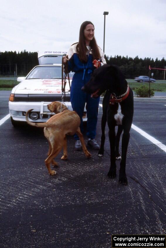 Amity Trowbridge walks her dogs in front of the Toyota Celica All-trac she and Janice Damitio shared.