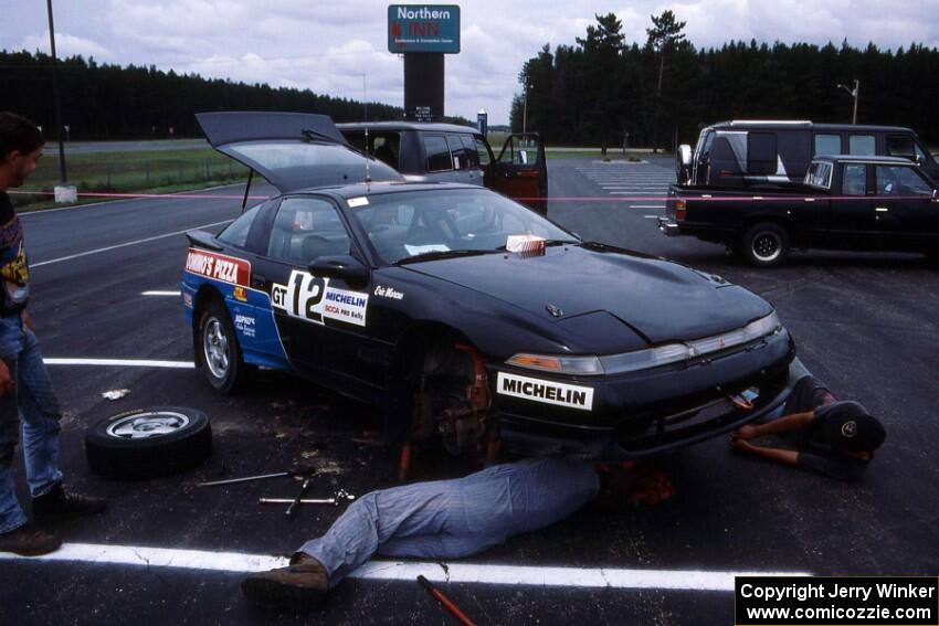 Eric Marcus does some last minute prep-work on the Mitsubishi Eclipse GSX he and Cal Landau shared.