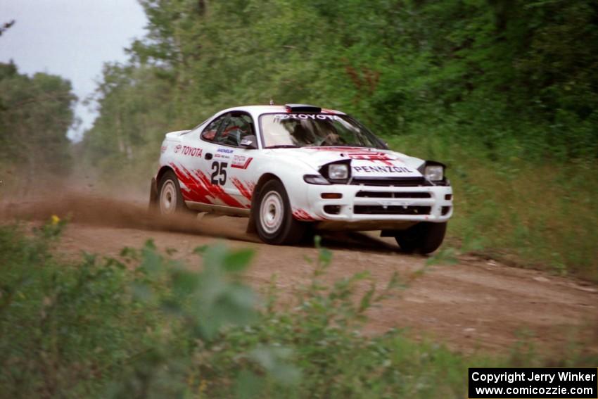 Jamaicans Jeff Panton / Rudy Meikle come over a crest in their Toyota Celica GT-4 on Indian Creek Trail Rd.