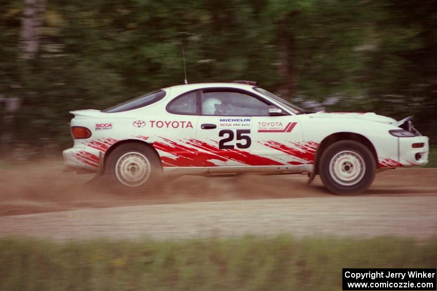 Jeff Panton / Rudy Meikle accelerate their ex-Carlos Sainz Toyota Celica GT-4 away from the spectator area at the county road.