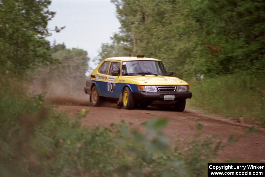 Sam Bryan / Rob Walden drift their Saab 900 through a sweeper over a rise on Indian Creek Trail Rd.