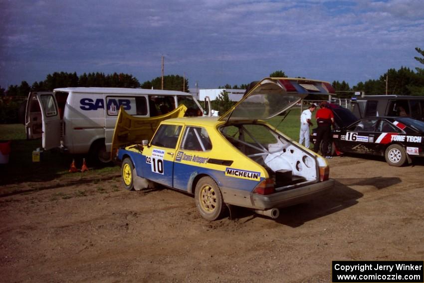 Sam Bryan / Rob Walden get their Saab 900 serviced in Park Rapids on day two of the rally.