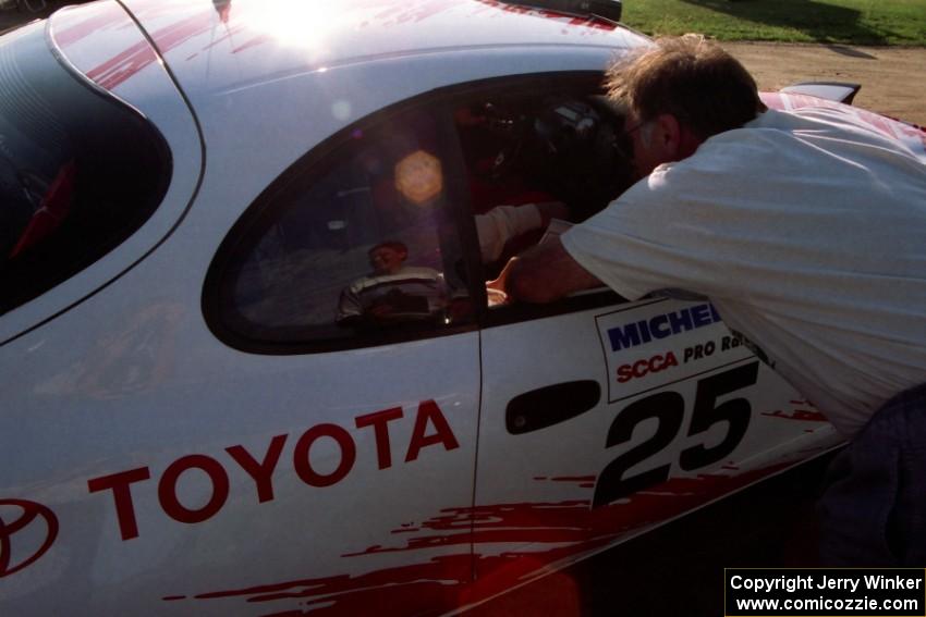 Dave Fuss chats with Jeff Panton / Rudy Meikle in their Toyota Celica GT-4 before they leave Park Rapids service.