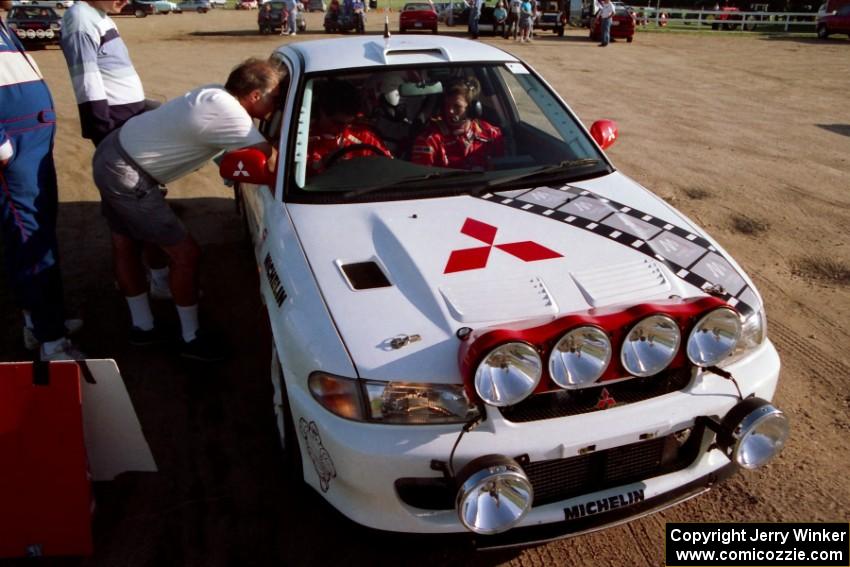 Dave Fuss chats with Henry Joy IV / Chris Griffin in their Mitsubishi Lancer Evo II before they leave Park Rapids service.