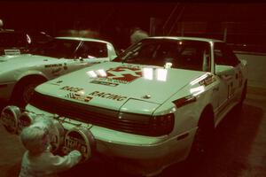 The Janice Damitio / Amity Trowbridge Toyota Celica All-trac is blessed by a small child at parc expose.