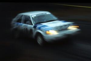 Mitch McCullough / John Elkin blast through the first few corners of SS1 in their Mazda 323GTX.