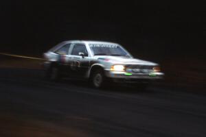 Gail Truess / Paul Truess were a DNF on day one in their Chevy Citation seen here at speed on SS1.