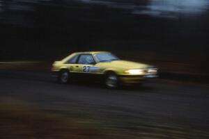 Don Rathgeber / Greg Brown at speed in the Huron Mountains in the Hairy Canary Ford Mustang.