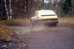 The Sam Bryan / Rob Walden SAAB 900 spays gravel on a fast S-curve on the Delaware Mine stage.