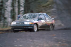 The Tad Ohtake / Bob Martin Ford Escort GT at speed on Delaware Mine stage.