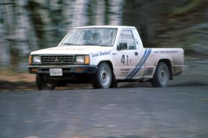 Dave Turner / Ben Bradley Mitsubishi Pickup at speed on the Delaware Mine stage.