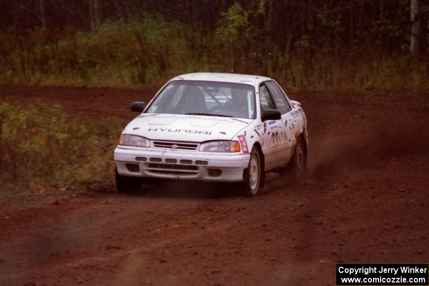 Tom Ottey / Pam McGarvey do a shakedown run on the press stage in their Rod Millen built Hyundai Elantra.