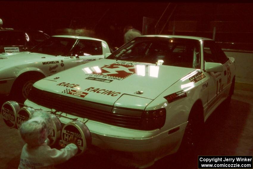 The Janice Damitio / Amity Trowbridge Toyota Celica All-trac is blessed by a small child at parc expose.