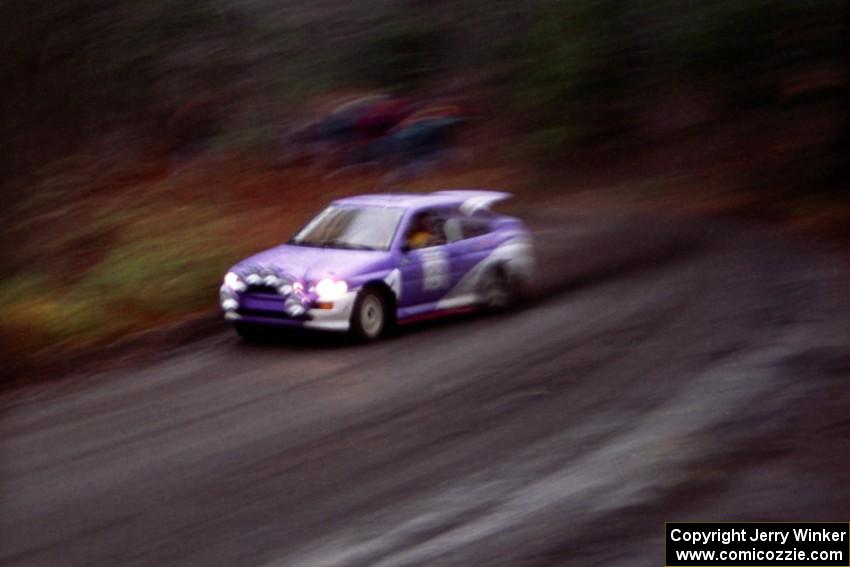 The Carl Merrill / John Bellefleur Ford Escort Coswort RS rockets away from the start just after the rain began.