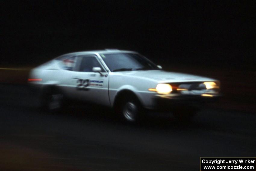 Chris Czyzio / Eric Carlson take their Plymouth Arrow down a fast forest road in the Huron Mountains.