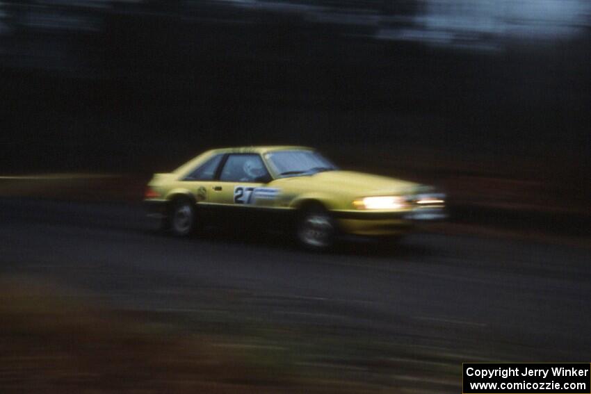 Don Rathgeber / Greg Brown at speed in the Huron Mountains in the Hairy Canary Ford Mustang.