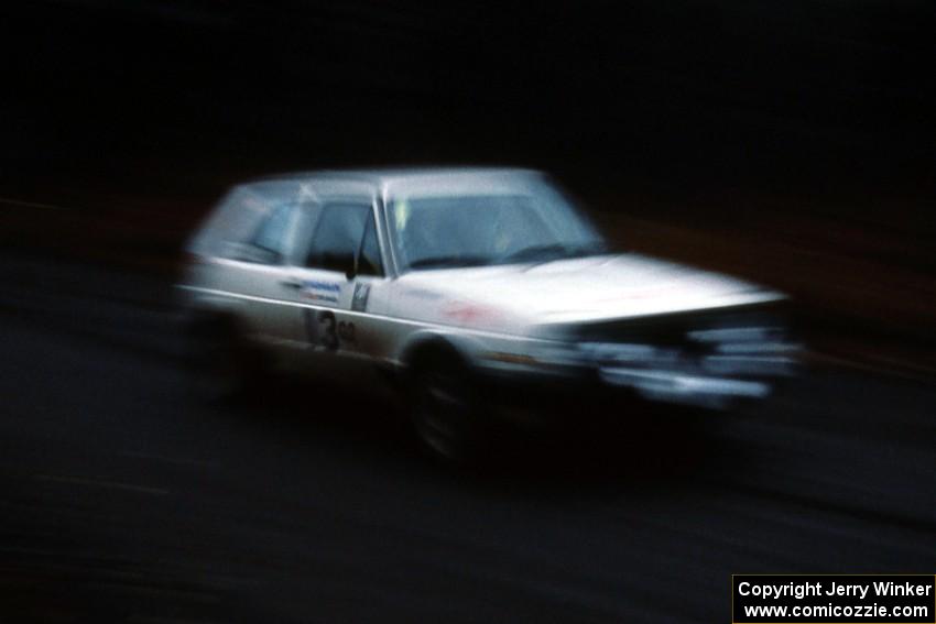 Wayne Prochaska / Annette Prochaska VW GTI at speed on SS1 in the Huron Mountains.