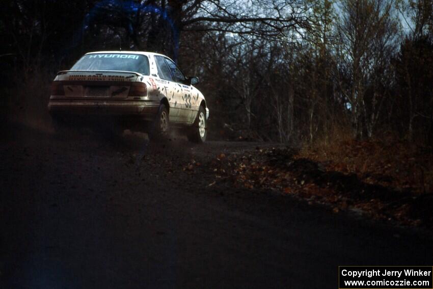 The Tom Ottey / Pam McGarvey Hyundai Elantra blasts out of a right-hander on Delaware Mine. Unfortunately they also were a DNF.