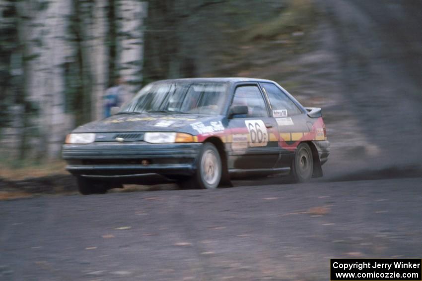 The Tad Ohtake / Bob Martin Ford Escort GT at speed on Delaware Mine stage.