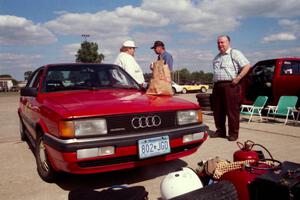 Jay Thompson pays a visit to Norm Johnson at his Audi 4000 Quattro while Norm's dad smiles