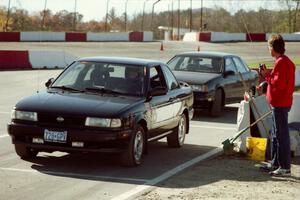 Jeff Clements' Nissan Sentra SE-R and ???'s Stock(?) Ford Taurus at the start line