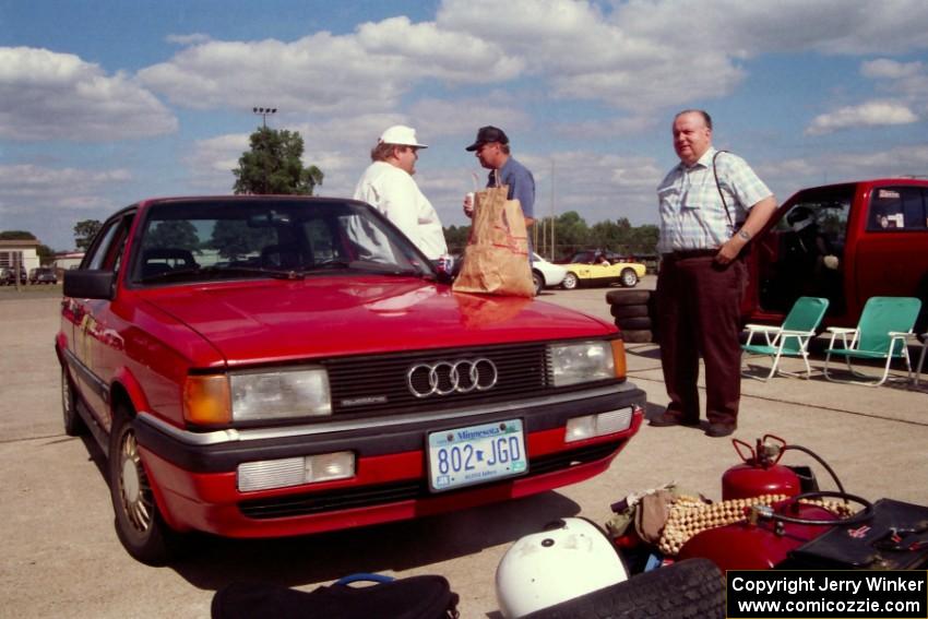 Jay Thompson pays a visit to Norm Johnson at his Audi 4000 Quattro while Norm's dad smiles