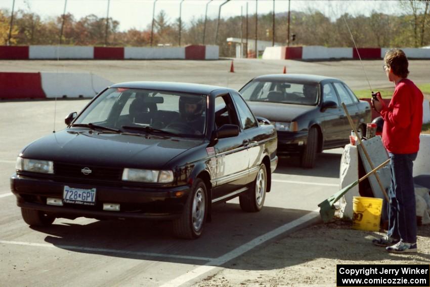 Jeff Clements' Nissan Sentra SE-R and ???'s Stock(?) Ford Taurus at the start line