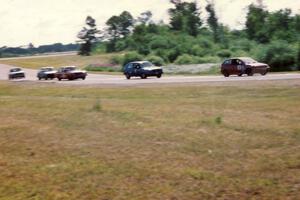 Improved Touring and Showroom Stock cars stream into corner 7.