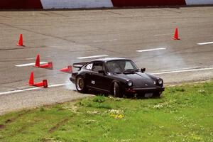 Jeff Lawrence's A Stock Porsche 911 spins to the infield