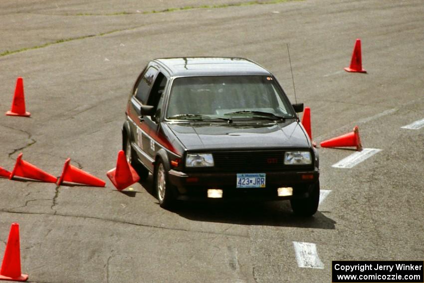 John Lyon's E Stock VW GTI clips a cone