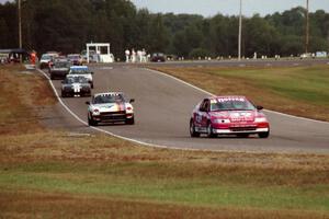 The front of the Enduro field streams through turn six into seven