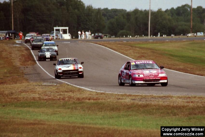 The front of the Enduro field streams through turn six into seven