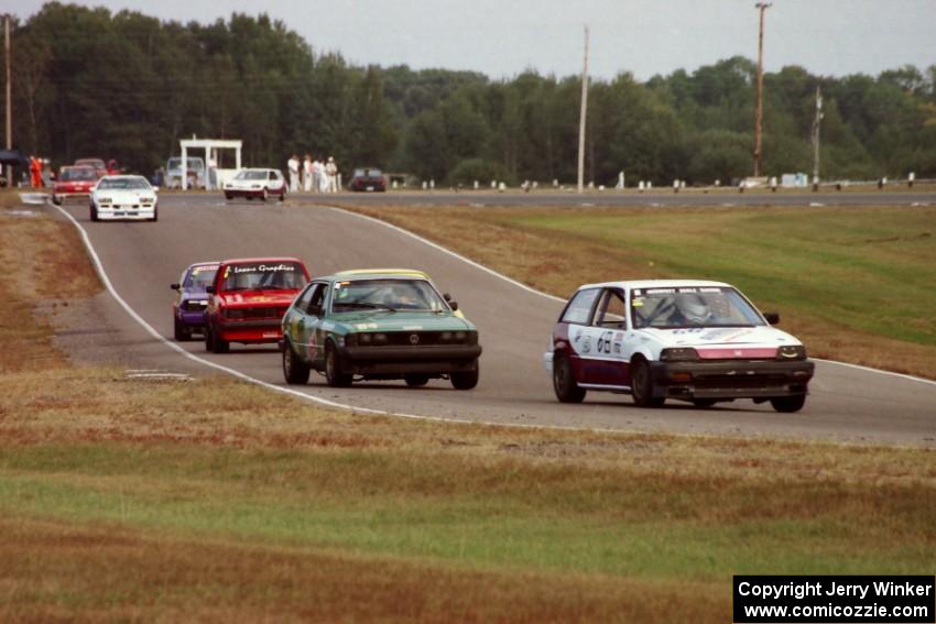 Cars in the Enduro race stream out of turn six into seven.