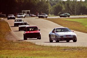 Enduro cars stream out of turn six into seven