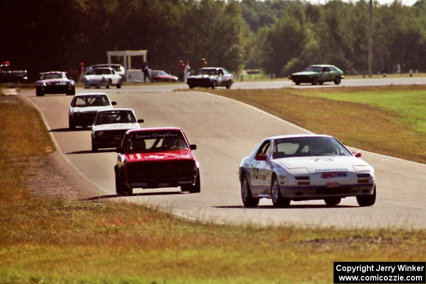 Enduro cars stream out of turn six into seven