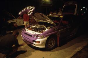 The Carl Merrill / John Bellefleur Ford Escort Cosworth gets serviced on the first night of the rally.