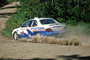 Paul Choiniere / John Buffum blast their Hyundai Elantra through a sweeper at the crossroads.