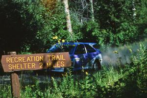 Carl Merrill / John Bellefleur prepare for a fast right at the crossroads in their Ford Escort Cosworth.