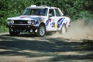 Mike Whitman / Paula Gibeault set their Datsun 510 up for a fast sweeper at the crossroads.