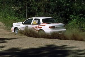 Lon Peterson / Bill Gutzmann at speed through the crossroads in their Kia Sephia.