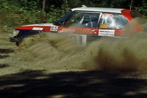 George Plsek / Renn Phillips nearly miss a call at the crossroads and come sliding to a stop in their SAAB 99.