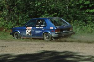 Mark Utecht / Paul Schwerin take a far inside line at the crossroads in their Dodge Omni GLH-Turbo.