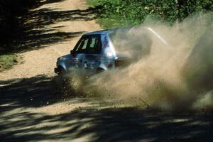 Jason Anderson / Jared Kemp drift wide at the crossroads in their Dodge Omni.