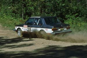 Eric Schroeder / Jennie Mynhier drift their VW Jetta GLI through the crossroads.